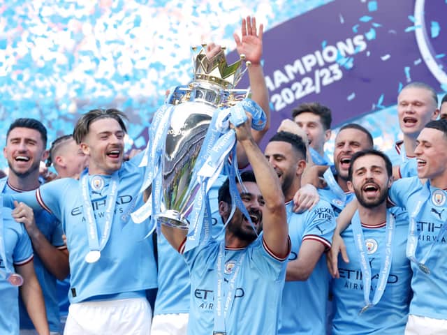 Ilkay Guendogan lifts the Premier League trophy with Man City after win over Chelsea
