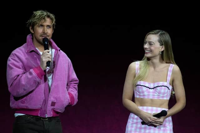 Actors Ryan Gosling (L) and Margot Robbie speak on stage during the studio presentation from Warner Bros Pictures during CinemaCon, the official convention of the National Association of Theatre Owners, at The Colosseum at Caesars Palace on April 25, 2023 in Las Vegas, Nevada. (Photo by VALERIE MACON / AFP) (Photo by VALERIE MACON/AFP via Getty Images)