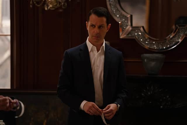 Jeremy Strong as Kendall Roy in Succession Season 4 Episode 10 'With Open Eyes', holding a piece of tape (Credit: HBO)