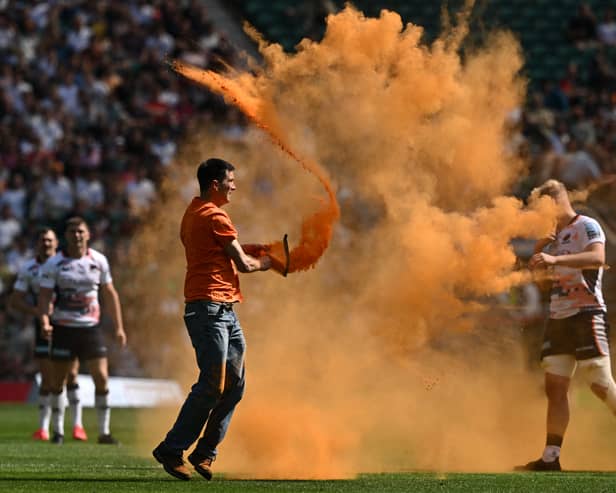 Just Stop Oil activists throw paint on Twickenham pitch