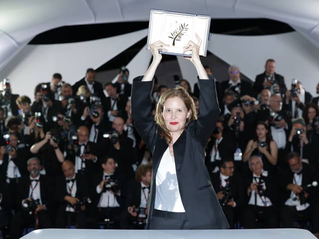 Justine Triet poses with The Palme D'Or Award for 'Anatomy of a Fall' during the Palme D'Or winners photocall at the 76th annual Cannes film festival at Palais des Festivals on May 27, 2023 in Cannes, France. (Photo by Pascal Le Segretain/Getty Images)