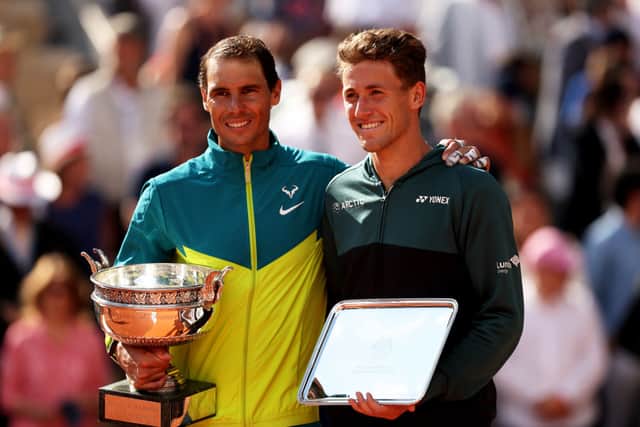 Rafael Nadal celebrates his 22nd Grand Slam title with runner-up Casper Ruud
