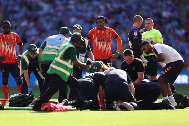 Tom Lockyer collapses during Championship play-off final