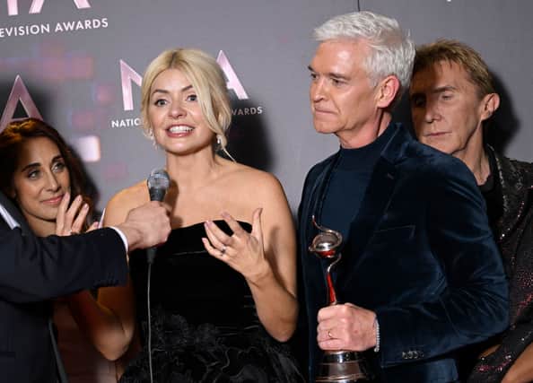 LONDON, ENGLAND - OCTOBER 13: Holly Willoughby and Phillip Schofield with the Best Daytime award for 'This Morning', in the winners' room at the National Television Awards 2022 at OVO Arena Wembley on October 13, 2022 in London, England. (Photo by Gareth Cattermole/Getty Images)

