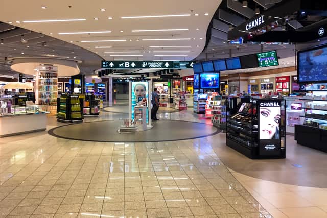 Making a small purchase at the airport seems to soothe banking algorithms. Credit: adobe