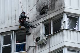 A specialist inspects the damaged facade of a multi-storey apartment building after a reported drone attack in Moscow (Photo: KIRILL KUDRYAVTSEV/AFP via Getty Images)