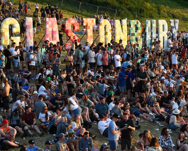 Festivalgoers attend the Glastonbury festival near the village of Pilton in Somerset, southwest England, on June 22, 2022. - (Photo by Andy Buchanan / AFP) (Photo by ANDY BUCHANAN/AFP via Getty Images)