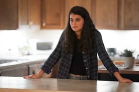 Sofia Black-D'Elia as Sam Fink in Single Drunk Female, leaning on a kitchen counter (Credit: Freeform/Danny Delgado)