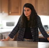 Sofia Black-D'Elia as Sam Fink in Single Drunk Female, leaning on a kitchen counter (Credit: Freeform/Danny Delgado)
