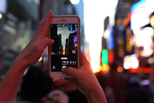 Manhattanhenge is a popular event for people to try and capture the perfect Instagram-esque image - Credit: Getty