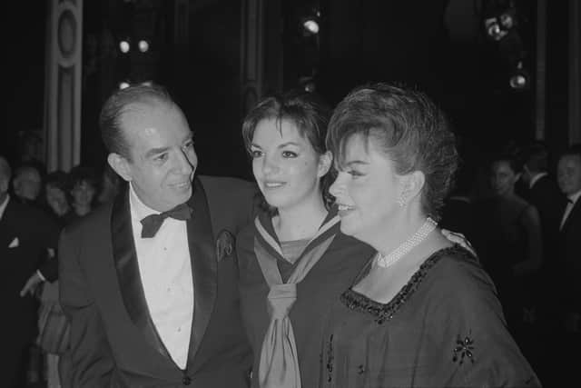 American actress and singer Liza Minnelli with her father, Italian-American movie director Vincente Minnelli (1903 - 1986), and her mother, American actress and singer Judy Garland (1922 - 1969), backstage after she opened in 'Flora the Red Menace' at the Alvin Theatre, New York, US, 11th May 1965. (Photo by Regan/Daily Express/Hulton Archive/Getty Images)