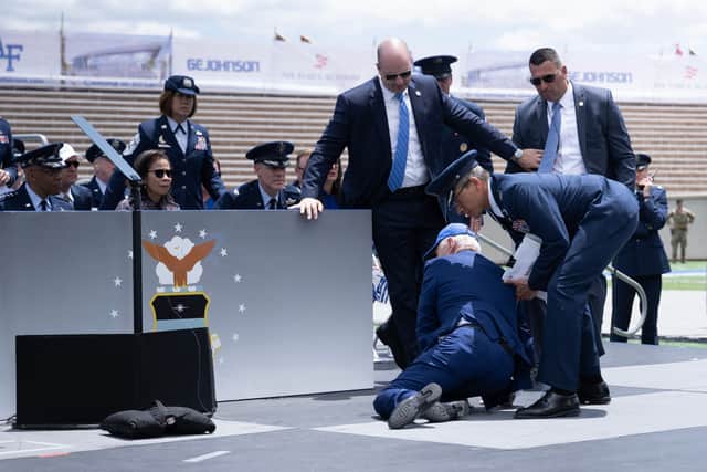 US President Joe Biden takes a fall onstage at an Air Force graduation ceremony. (Credit: AFP via Getty Images)