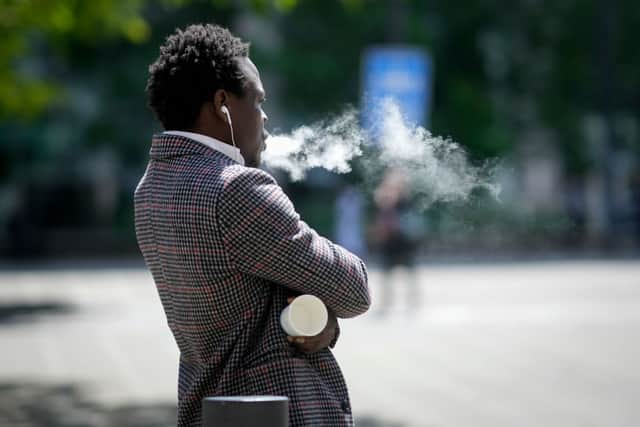 A man  smokes a vape device on May 30, 2023 in Manchester, England. (Photo by Christopher Furlong/Getty Images)