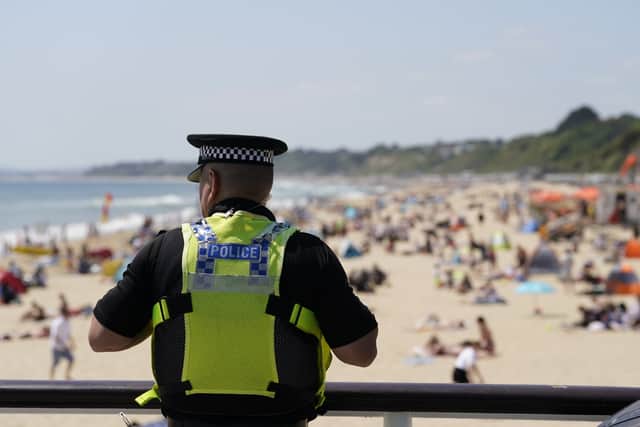 A police officer looks out over Bournemouth beach, two days after the fatal incident (Photo: Andrew Matthews/PA Wire)