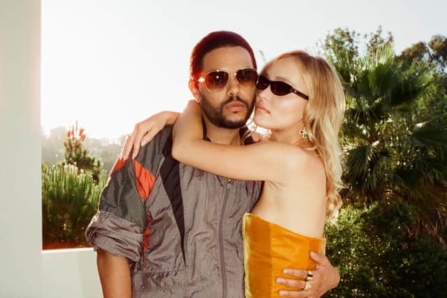 Abel Tesfaye as Tedros and Lily-Rose Depp as Jocelyn in The Idol, their arms around one another (Credit: HBO)