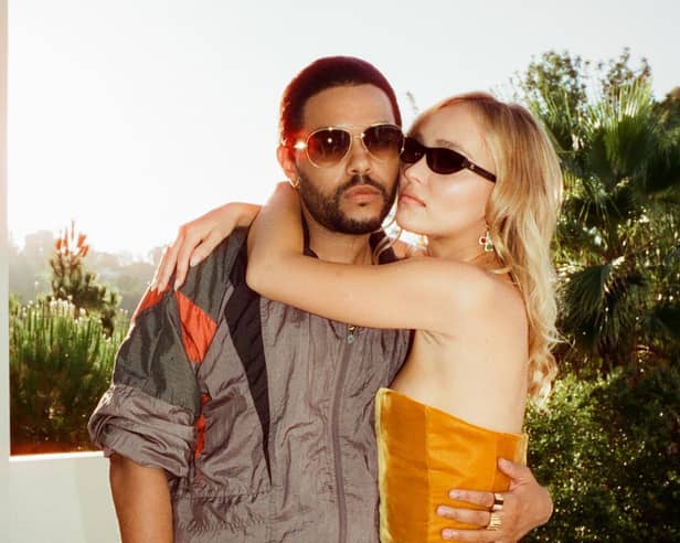 Abel Tesfaye as Tedros and Lily-Rose Depp as Jocelyn in The Idol, their arms around one another (Credit: HBO)