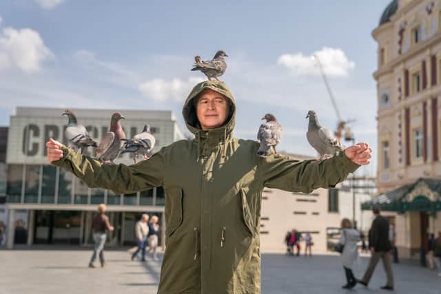 Robert Carlyle as Gaz in The Full Monty, with pigeons perched on his head and arms (Credit: Ben Blackall/Disney+) 