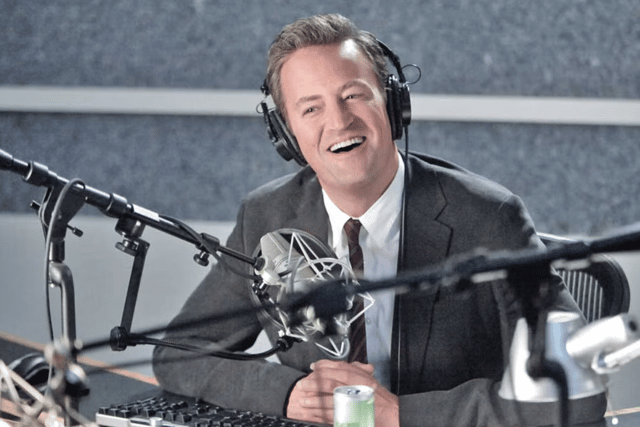 Matthew Perry as Ryan King in Go On, presenting a radio talk show (Credit: NBC)