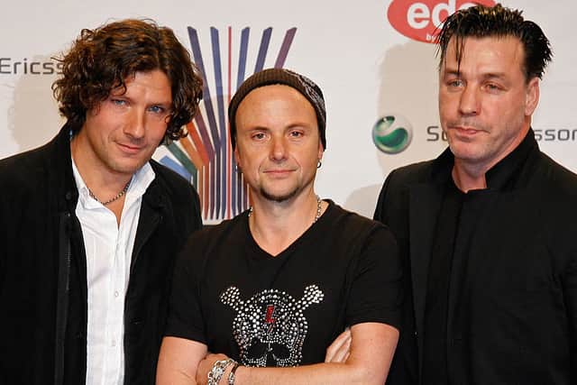 Members of the German band Rammstein (from L to R) Christoph Schneider, Paul Landers and Till Lindemann pose for photographers as they arrive for the MTV Europe Music Awards 2007 in Munich 01 November 2007. Credit: JOERG KOCH/DDP/AFP via Getty Images