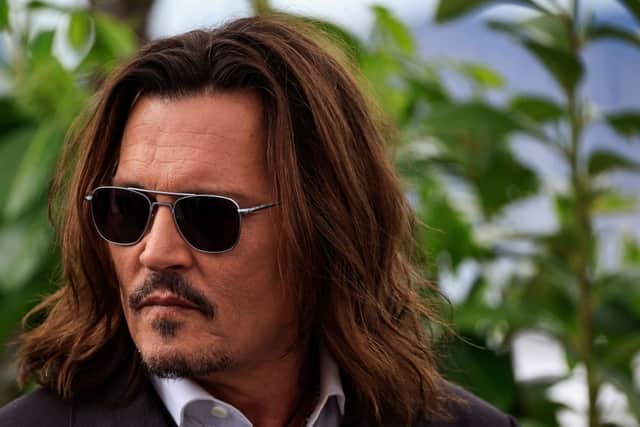 US actor Johnny Depp poses during a photocall for the film "Jeanne Du Barry" during the 76th edition of the Cannes Film Festival in Cannes, southern France, on May 17, 2023. (Photo by Valery HACHE / AFP) (Photo by VALERY HACHE/AFP via Getty Images)