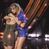 Maren Morris presents the Tour of the Year award for Reputation Stadium Tour to Taylor Swift on stage at the 2019 iHeartRadio Music Awards on March 14, 2019 in Los Angeles, California. (Photo by Kevin Winter/Getty Images for iHeartMedia)
