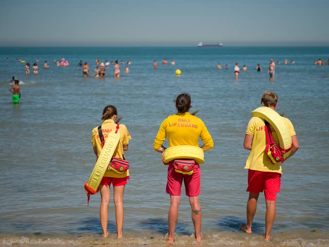 Lifeguards stand on duty as swimmers enjoy themselves in the sea at Margate beach in 2020 (Photo: Leon Neal/Getty Images)