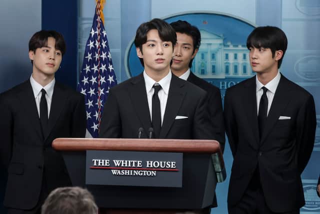 (L-R) Jimin, Jungkook, RM and Jin of the South Korean pop group BTS speak at the daily press briefing at the White House on May 31, 2022 in Washington, DC. BTS met with U.S. President Joe Biden to discuss Asian inclusion and representation, and to discuss the recent rise in anti-Asian hate crimes. (Photo by Kevin Dietsch/Getty Images)