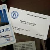 The identification and business card of former FBI agent Robert Hanssen (Photo: PAUL J. RICHARDS/AFP via Getty Images)