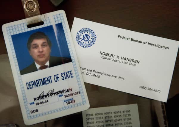 The identification and business card of former FBI agent Robert Hanssen (Photo: PAUL J. RICHARDS/AFP via Getty Images)