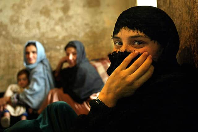 An Afghan female inmate sits in her cell while waiting to be released from the women’s prison November 9, 2002 in Kabul, Afghanistan. Credit: Getty Images