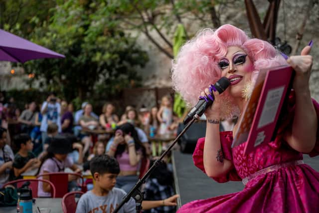 Drag queen 'story time' events take place across the world, with drag artists reading stories to families. (Credit: Getty Images)