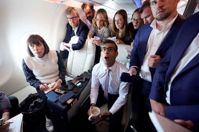 Rishi Sunak holds a huddle with political journalists on board a government plane as he heads to Washington DC (Image: Niall Carson/PA Wire)