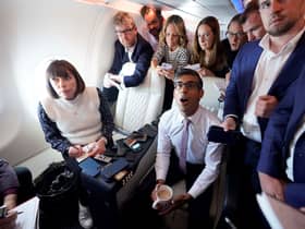 Rishi Sunak holds a huddle with political journalists on board a government plane as he heads to Washington DC (Image: Niall Carson/PA Wire)