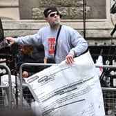 LONDON, ENGLAND - JUNE 07: Brian Harvey displays a screenshot email outside the Mirror Group Phone hacking trial at the Rolls Building at High Court on June 07, 2023 in London, England. Prince Harry is one of several claimants in a lawsuit against Mirror Group Newspapers related to allegations of unlawful information gathering in previous decades. (Photo by Kate Green/Getty Images)