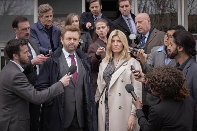 Michael Sheen as Andrew and Sharon Horgan as Nicci in Best Interests, surrounded by press outside court (Credit: BBC/Chapter One/Kevin Baker)