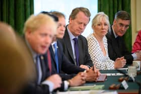 Britain's Culture Secretary Nadine Dorries (2R) looks on as Prime Minister Boris Johnson (L) addresses his Cabinet ahead of the weekly Cabinet meeting in Downing Street on June 07, 2022 in London, England. The Prime Minister survived a confidence vote last night but potentially has long-term problems ahead as he faces rebellion within his party. (Photo by Leon Neal - WPA Pool/Getty Images)