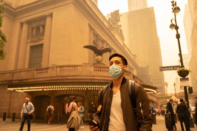 A person wears a face mask as smoke from Canadian wildfires blankets Manhattan on June 7, 2023 in New York City. (Photo by David Dee Delgado/Getty Images)