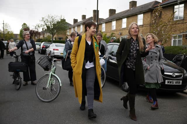Sian Berry (R), Green Party Mayoral Candidate walks along a street with Green Party MP Caroline Lucas as she campaigns on May 5, 2021 in London, England.  (Photo by Dan Kitwood/Getty Images)