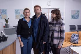 Sharon Horgan as Nicci, Michael Sheen as Andrew, and Alison Oliver as Katie in Best Interests, in a children's hospital ward waiting room (Credit: BBC/Chapter One/Kevin Baker)