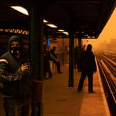 A person waiting for the Subway wears a filtered mask as smoky haze from wildfires in Canada blankets the Bronx borough of New York City (Image: Getty)