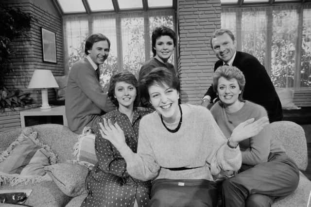 The cast of Good Morning Britain, UK, 17th November 1983; including singer Dana, soccer player Bobby Moore, and television presenters Wincey Willis, Nick Owen and Anne Diamond. (Photo by Mike Moore/Daily Express/Hulton Archive/Getty Images)