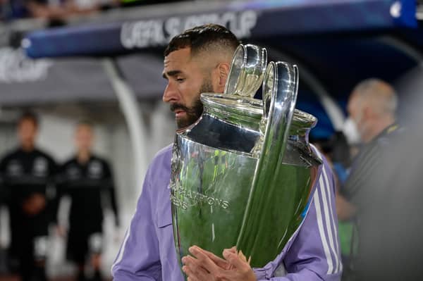 Real Madrid's French forward Karim Benzema carries out the Champions League trophy prior to the UEFA Super Cup football match. Picture: Getty Images