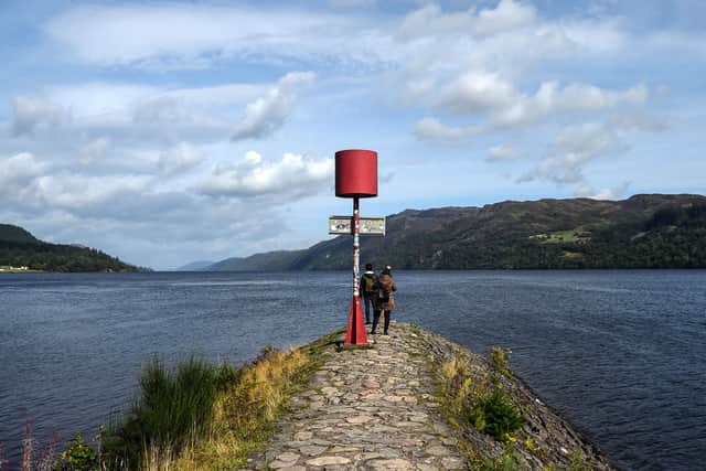 Tourists beside Loch Ness at Fort Augustus in Drumnadrochit, Scotland, on September 5, 2019 (Photo by Andy Buchanan / AFP)