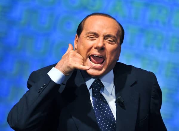 The former Italian Prime Minister Silvio Berlusconi gestures as he takes part at the meeting of young people of PDL (People of Freedom), in central Rome, on September 9, 2009. AFP PHOTO/ ANDREAS SOLARO (Photo by Andreas SOLARO and - / AFP) (Photo by ANDREAS SOLARO/AFP via Getty Images)