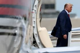 Republican presidential candidate former U.S. President Donald Trump arrives at the Miami International Airport June 12, 2023 in Miami, Florida. Trump is scheduled to appear tomorrow in federal court for his arraignment on charges including possession of national security documents after leaving office, obstruction, and making false statements.  (Photo by Win McNamee/Getty Images)