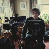 Samuel Blenkin as Davis in Black Mirror Season 6 episode 2 'Loch Henry', operating a video camera (Credit: Nick Wall/Netflix) 