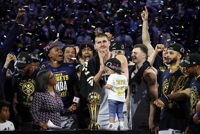 Nikola Jokic #of the Denver Nuggets celebrates with the Bill Russell NBA Finals Most Valuable Player Award after a 94-89 victory against the Miami Heat in Game Five of the 2023 NBA Finals to win the NBA Championship at Ball Arena on June 12, 2023 in Denver, Colorado. (Photo by Matthew Stockman/Getty Images)