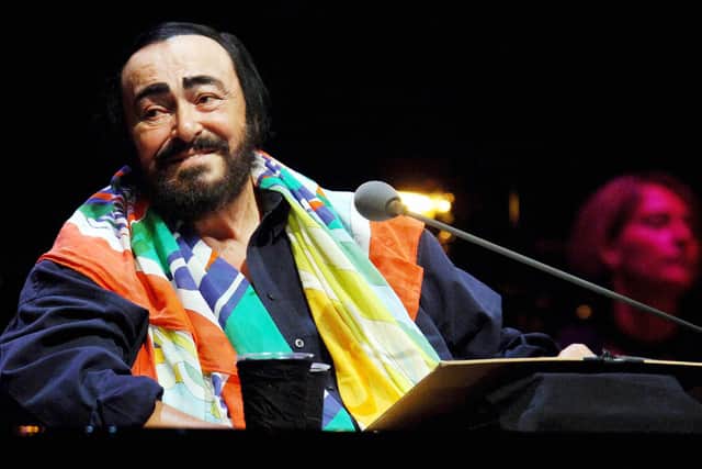 Picture taken 11 September 2005 shows Italian tenor Luciano Pavarotti performing during a concert "A Night To Remember" in Dusseldorf, western Germany. (Credit: HENNING KAISER/DDP/AFP via Getty Images)