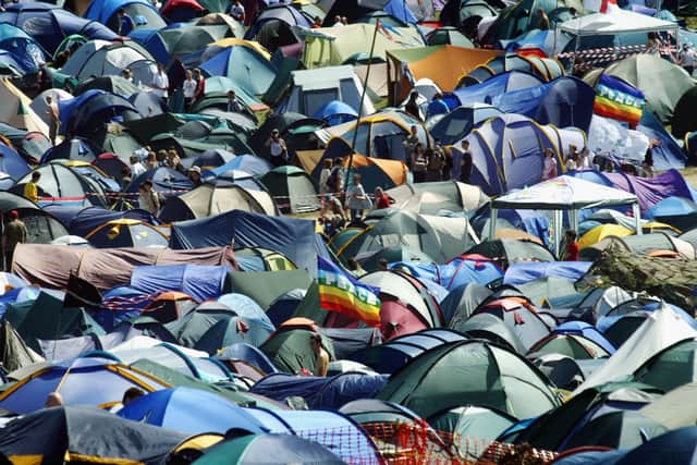 The fields of tents and festival-goers on June 25 2004 at Worthy Farm, Pilton, Somerset, at the 2004 Glastonbury Festival. (Photo by Matt Cardy/Getty Images)