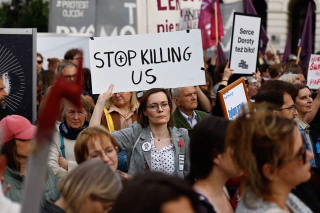 Polish women's rights activists have called for a change to strict laws after a woman in her fifth month of pregnancy died from sepsis last month. (Credit: AFP via Getty Images)